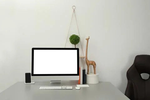 Modern workplace with computer and decor elements. Interior design Stock Photos