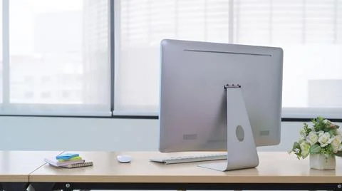Modern workplace with computer pc, potted plant and sticky notes on wooden table Stock Photos