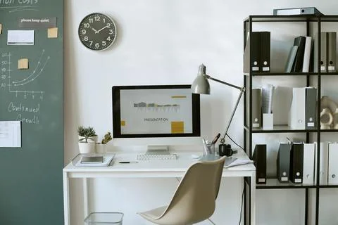Modern Workplace Desk Setup Displaying Business Analytics Presentation Stock Photos