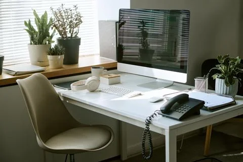 Modern Workplace with Desktop Computer and Headphones on Desk Stock-Fotos