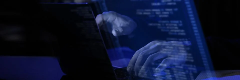 Modern workspace with blue virtual interface displaying fictional programming Stock-Fotos