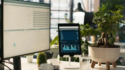 Modern workspace with key performance indicators data on display Stock Photos