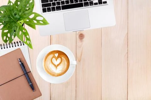 Modern workspace with laptop tablet,notebook and coffee cup copy space on woo Stock Photos