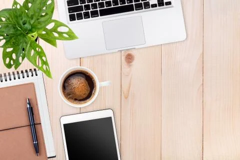 Modern workspace with laptop tablet,notebook and coffee cup copy space on woo Stock Photos