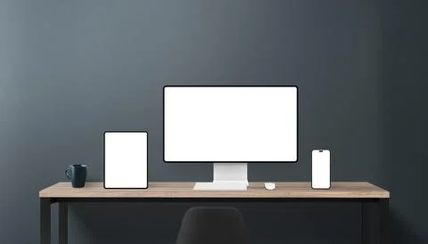 Modern workspace with vertical tablet, smartphone, and desktop monitor Stock Photos