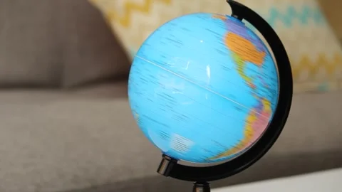 A modern world globe spinning and landing on the oceanic continent Stock Footage 340242403