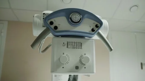 Modern X-ray machine in the X-ray room procedure room. Carrying out diagnostic Stock Footage 317088858
