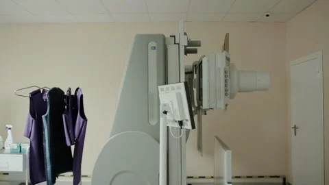 Modern X-ray machine in the X-ray room procedure room. Carrying out diagnostic Stock Footage 317806886