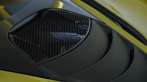 Modern yellow supercar engine bay hood with air intake Stock Footage 144687971
