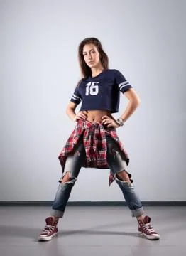 Modern young beautiful dancer posing on a studio background Stock Photos