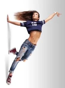 Modern young beautiful dancer posing on a studio background Stock Photos