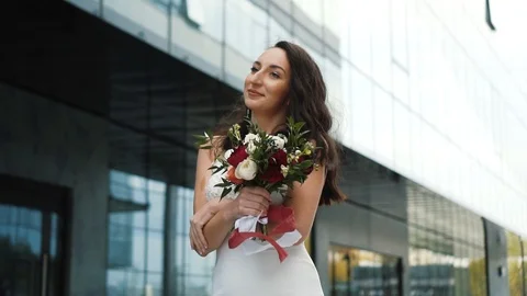 Modern young bride going in slow motion. Long haired married fashionable woman Video stock 123892663