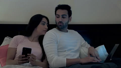 A modern young man with stubble completing his office work on a laptop Stock Footage 169904087