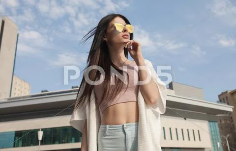 Modern young woman in sunglasses Stock Photos