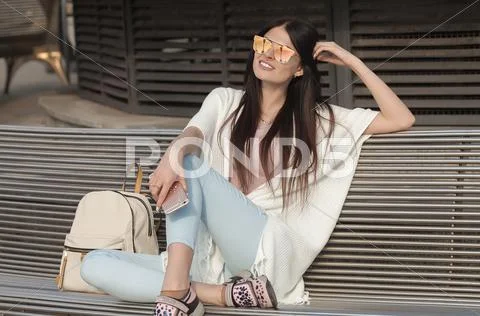 Modern young woman in sunglasses Stock Photos