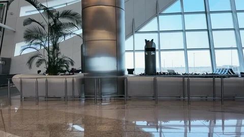 Modern Zayed airport terminal interior with view of large windows and decorat Stock Footage 336976490