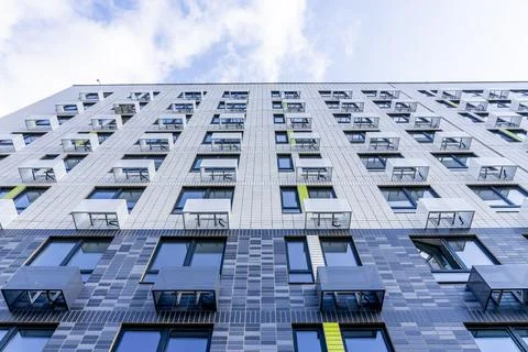Moderne multy-storey apartment facade of residential building. The view from  Stock Photos