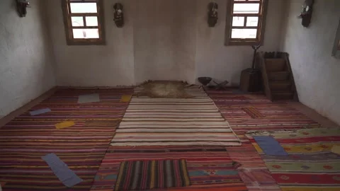 Modest rural mosque interior with worn carpets and aged plaster walls Stock Footage 341124762