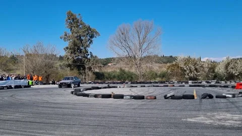 Modified Grey BMW E30 Drift Car Sliding Around Corner With Smoke At Racing Event Stock Footage 327300631