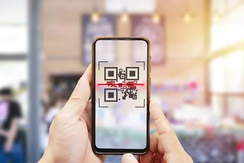 Modified inactive QR Code used. Person scanning QR code with smartphone Foto stock