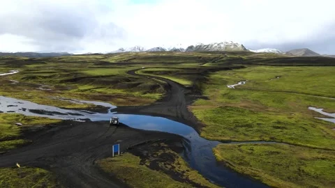 Modified Jeep crossing a river in the Icelandic highlands Stock Footage 142013686