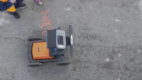 Modugno, Italy - December 2020: technicians use GPR to identify the undergrou Stock Footage 157386334
