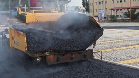 Modugno, Italy - March 20, 2019: Bitumen paving works with a asphalt paver of Vídeos de archivo 293081002