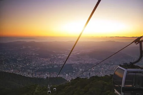 Modular cabins cable car against the bright sky, clouds ans mountains. Cableway Stock Photos
