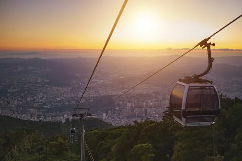Modular cabins cable car against the bright sky, clouds ans mountains. Cableway Stock-Fotos