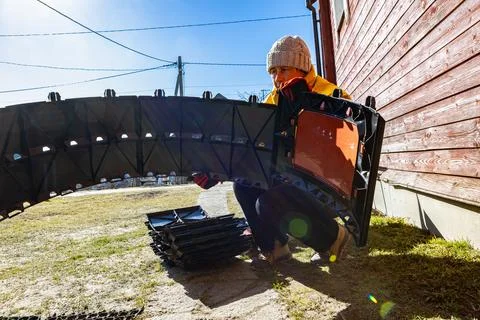 Modular compost bin taking shape from curved interlocking plastic panels wh.. Stock Photos