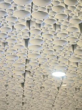 Modular cylindrical acoustic ceiling pattern Stock Photos