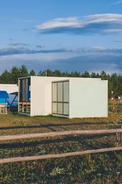 Modular frame house with panoramic windows on the edge of a pine forest, pref Stock Photos