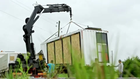 Modular home office space SIP panel shipping container house installation Stock Footage 300266660