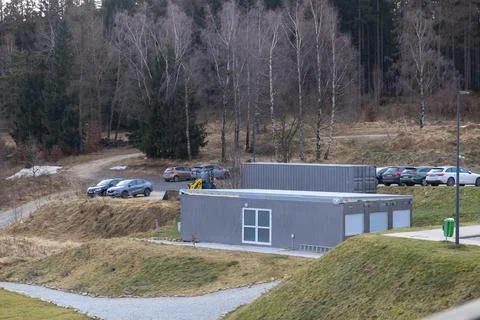 A modular office container structure placed in a rural landscape near a forest Stock Photos