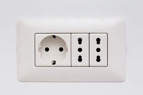 Modular socket composed by three power outlet on the wall Foto stock