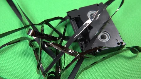 Moers / Germany - May 10 2019 : Pulling tape out of the vintage cassettes Stock Footage 107906931