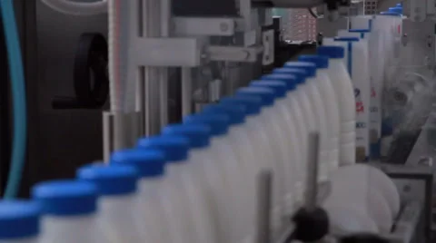 Mogilev, Belarus - May 3, 2015: Dairy Plant. Conveyor with milk  bottles - 4 Vídeos de archivo 59794471