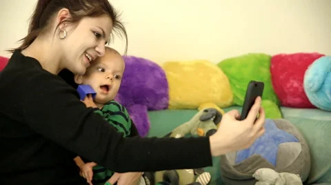 Moher is taking selfie with her son.FULL HD.dolly shot Video stock 48974150
