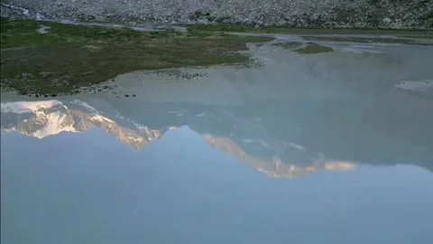 Moiry Glacier Sunrise Reverse Flight Over Mirror Lake Stock Footage 323379302