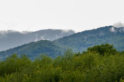 Moisture in the form of a pair of mountains rising into the clouds, mountain lan Fotos de archivo