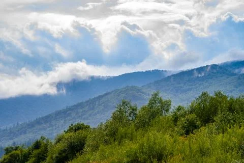 Moisture in the form of a pair of mountains rising into the clouds, mountain Fotos de archivo