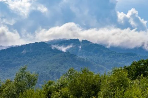 Moisture in the form of a pair of mountains rising into the clouds, mountain Foto stock