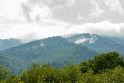 Moisture in the form of a pair of mountains rising into the clouds, mountain Foto stock