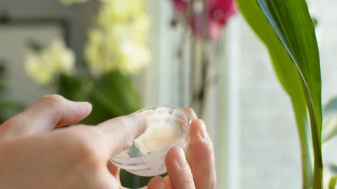Moisturizing arms and fingers using lotion sun protection cream balm from glass 스톡 동영상 90845854