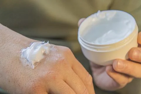 Moisturizing Cream Applied On Hand Fotos de archivo
