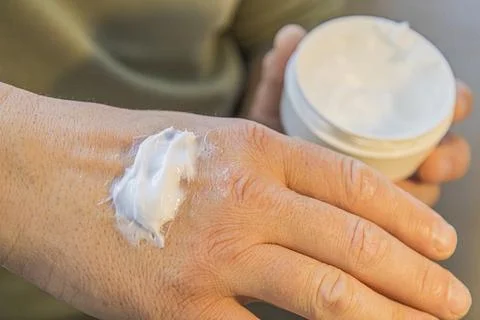 Moisturizing Cream Applied On Hand Stock Photos