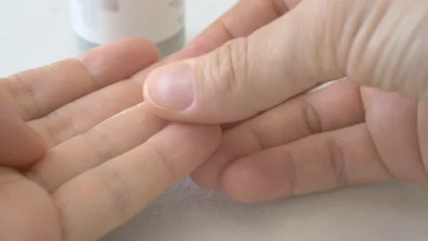 Moisturizing cream has been applied to the fingertips to protect the skin of the Stock Footage 155867991