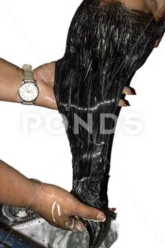 Moisturizing hair application Hydration hands salon white background Stock Photos