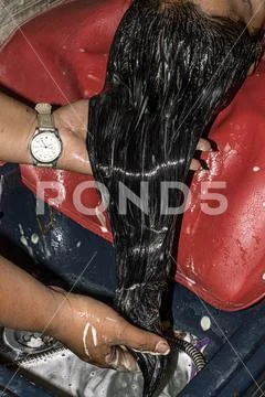 Moisturizing hair application Hydration hands salon Stock Photos