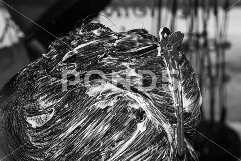 Moisturizing hair care application Hydration head detail black white Stock Photos
